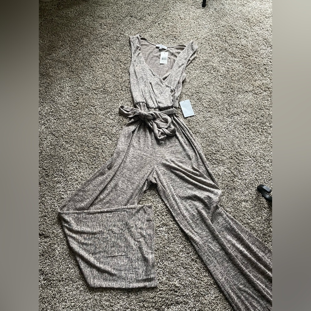 The VANITYROOM Jumpsuit in size L is NWT mocha/blk